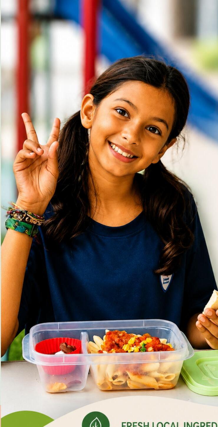 A smiling child with her Lunch-Ease lunch box